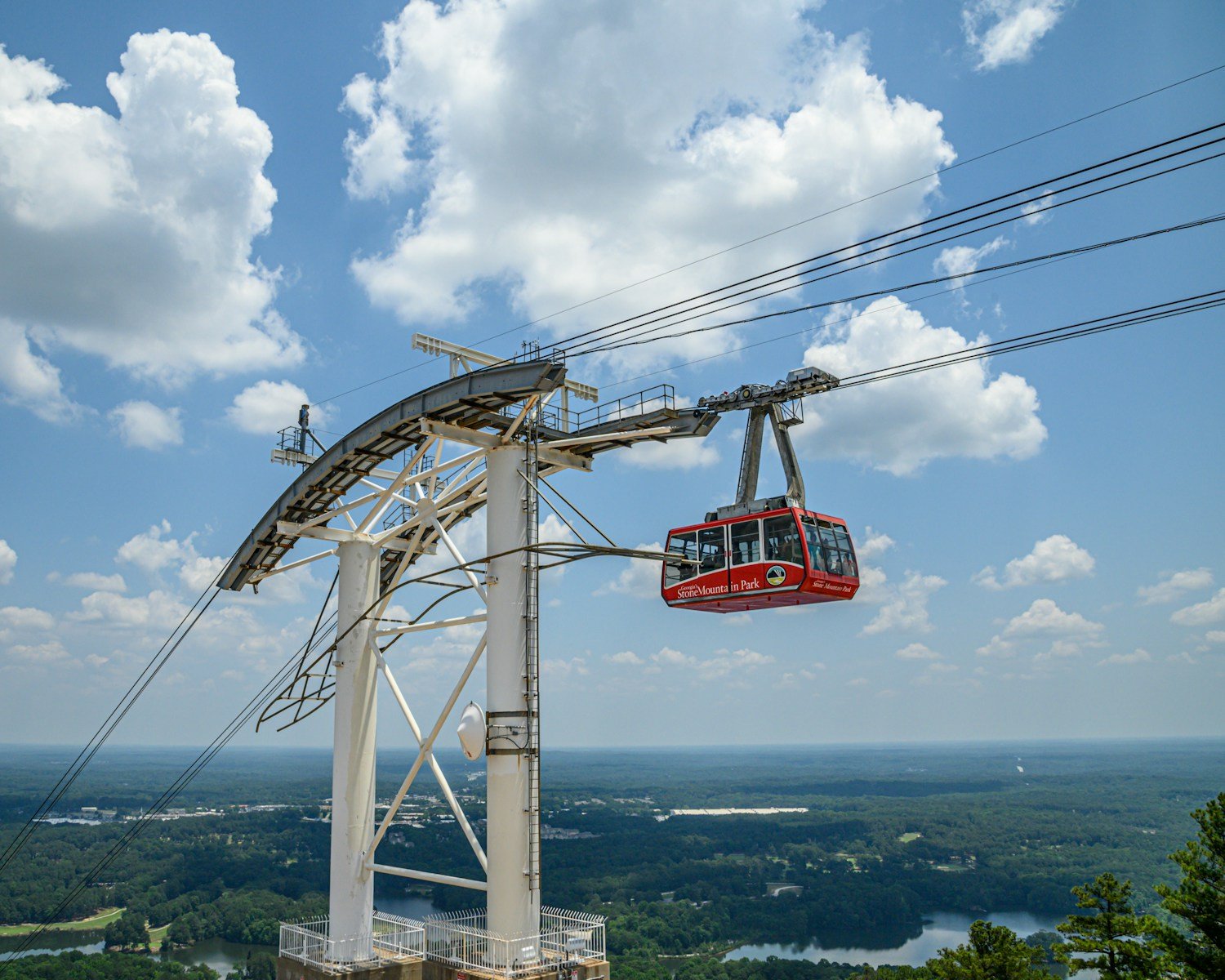 a cable car suspended over a city